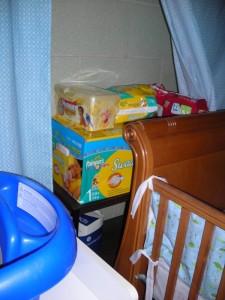 My secret diaper storage, cleverly hidden behind the crib.